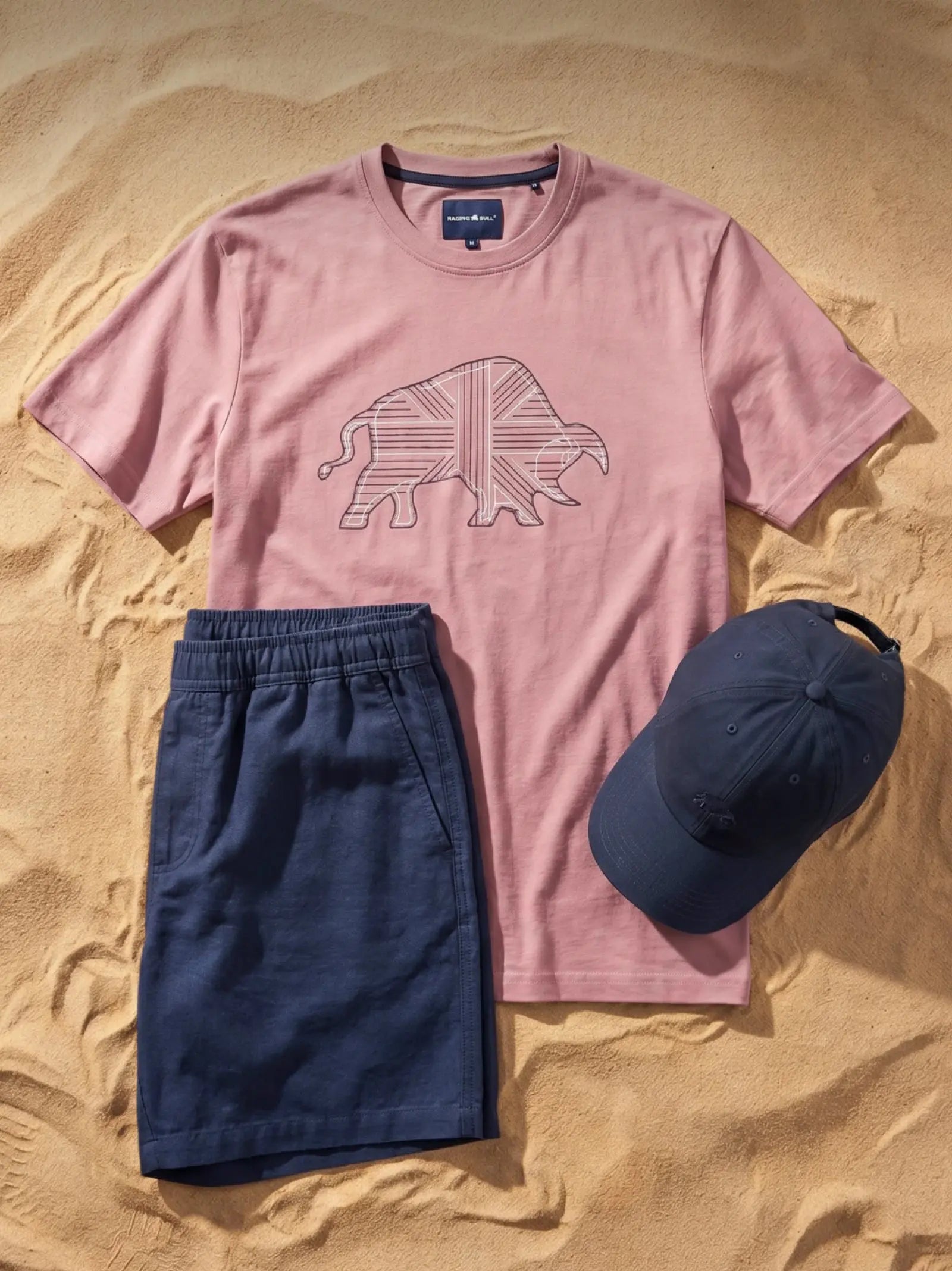 Summer shirts with short sleeves hanging on a rail.