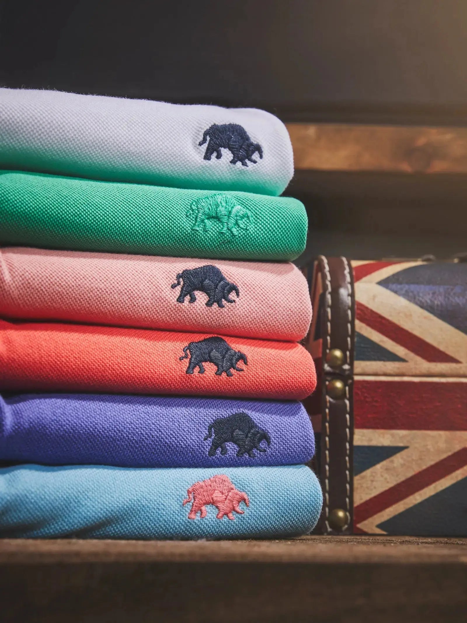 2 for £70 Organic Polo - Raging Bull Clothing - Polo shirts stacked on a wooden table
