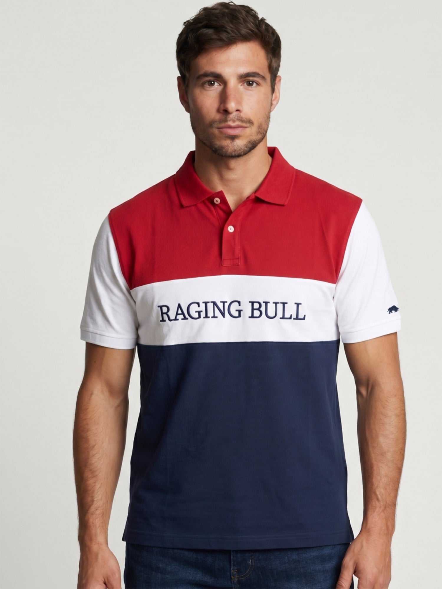 Man wearing a Raging Bull 2 colour panel pique polo in navy, front detail. 