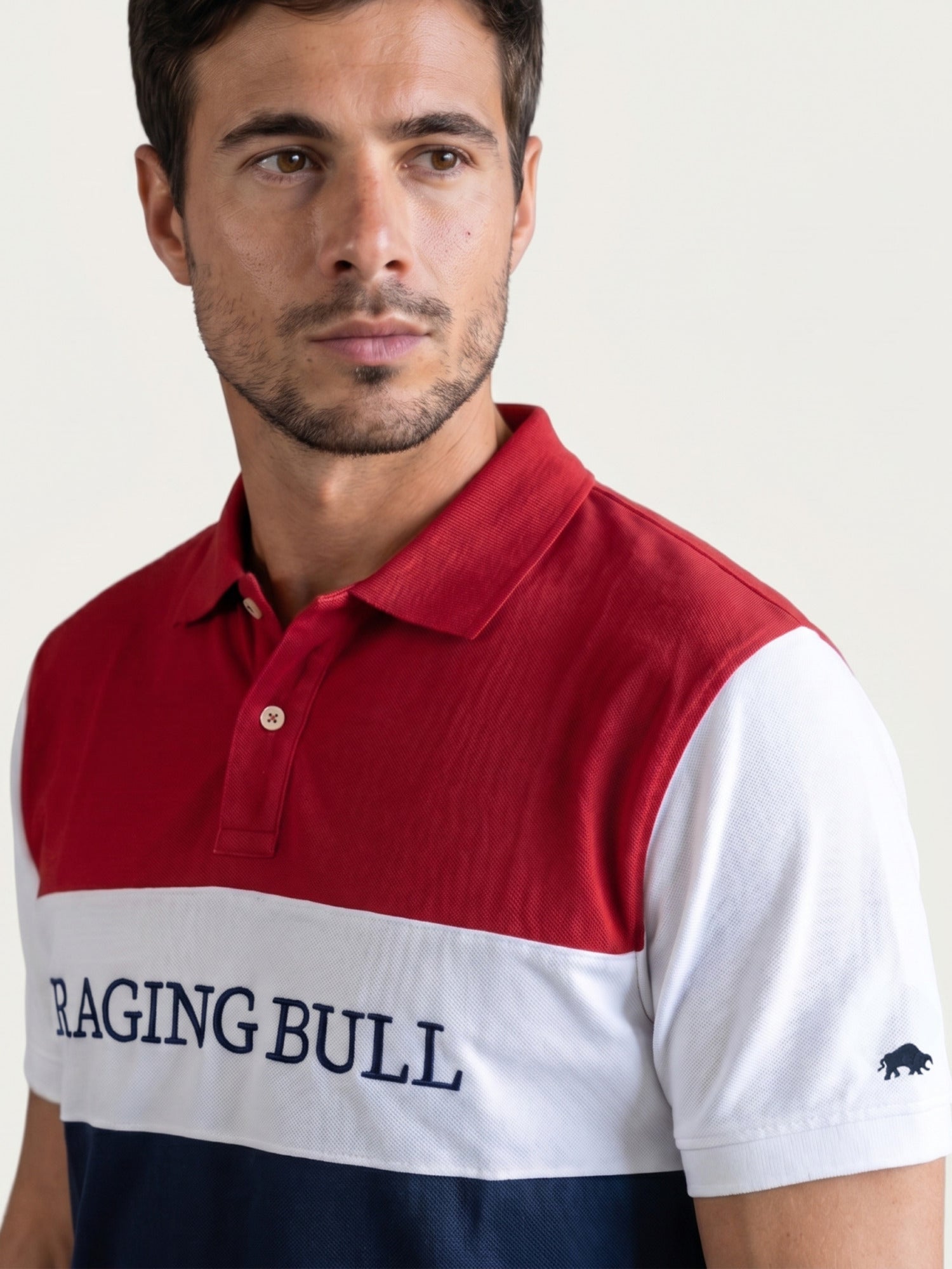 Man wearing a Raging Bull 3 colour panel pique polo in navy, front. 