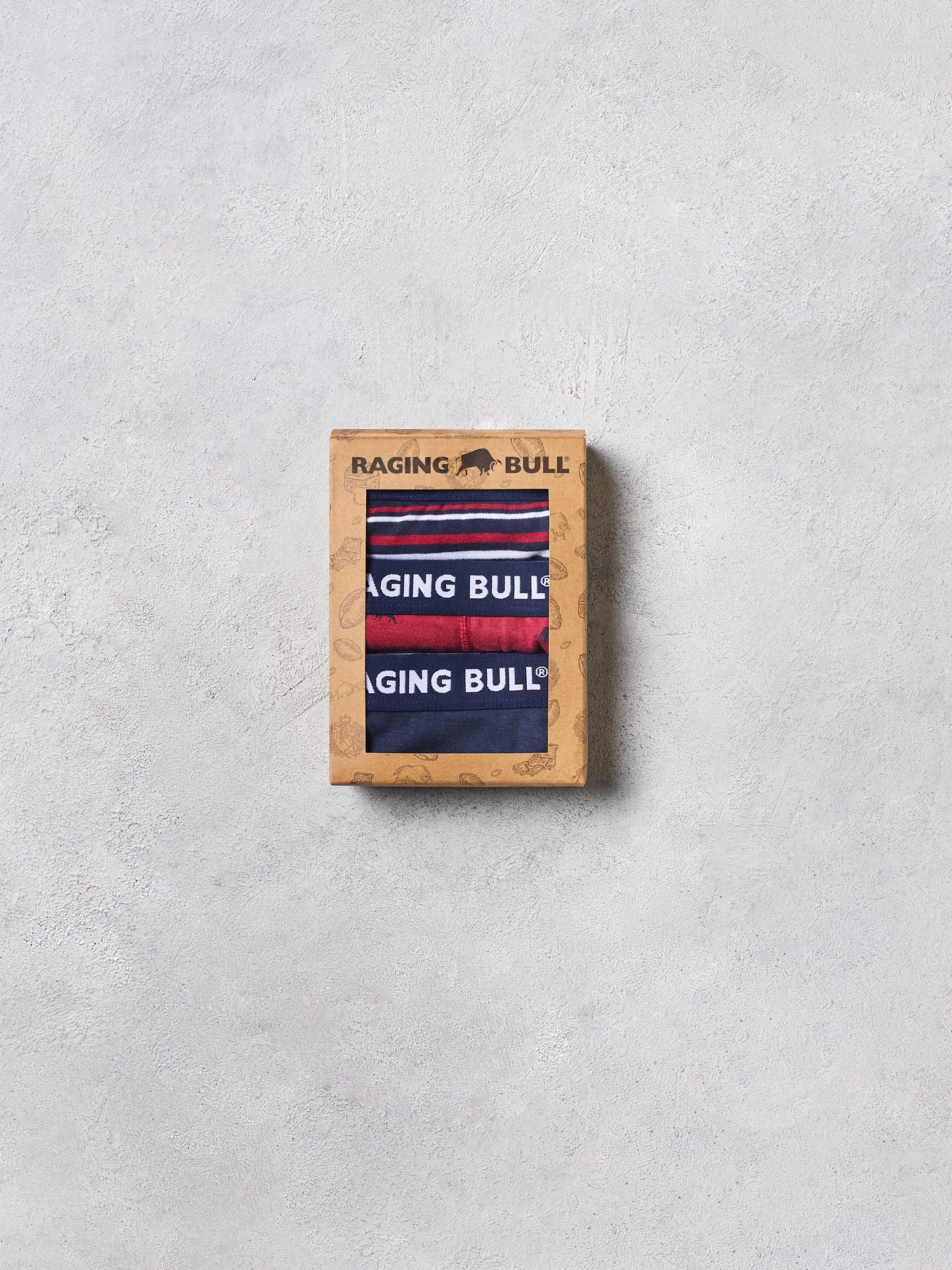 Raging Bull boxer briefs in a wooden box on a light gray background