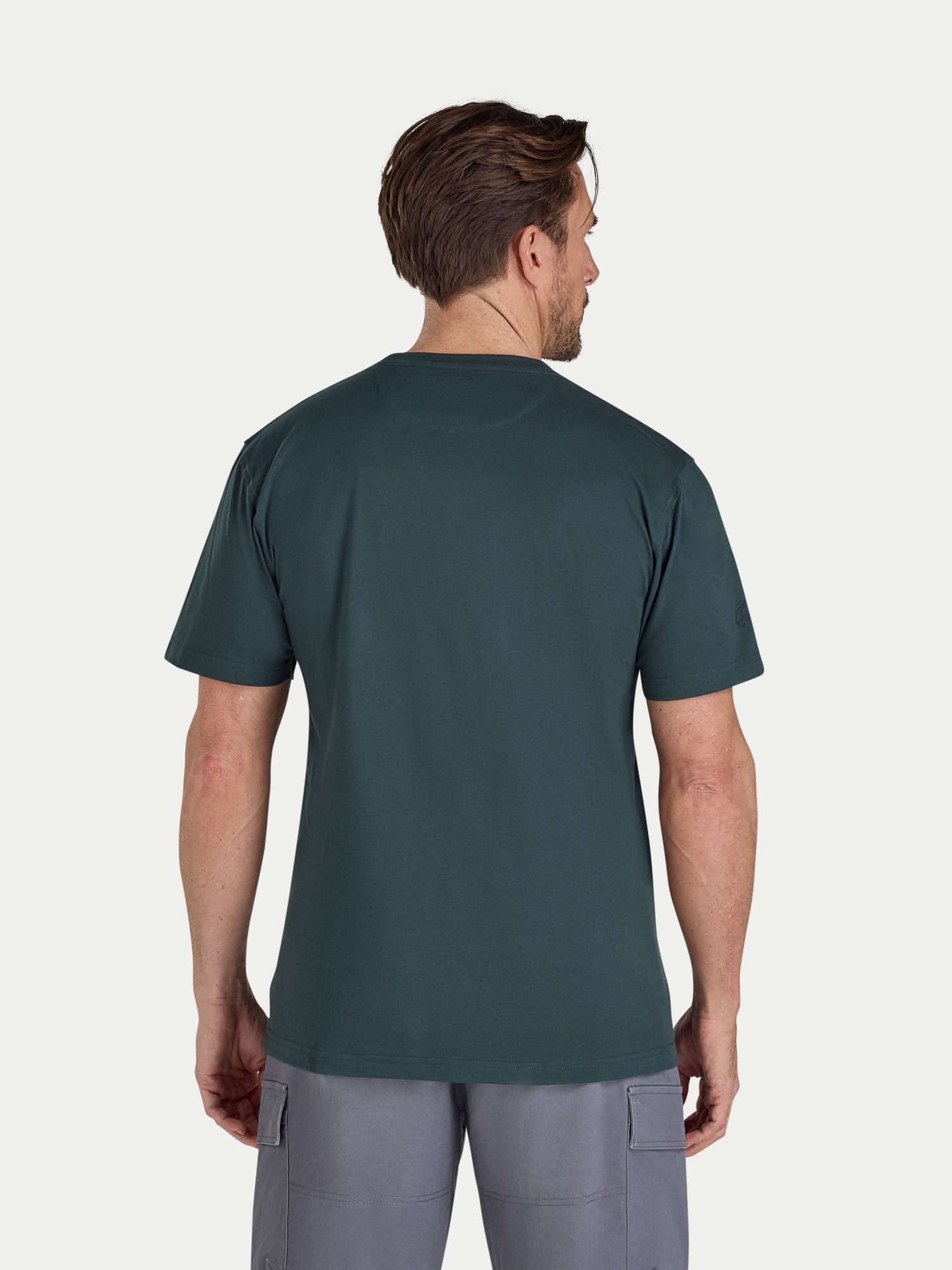 Man wearing a green t-shirt on a white background