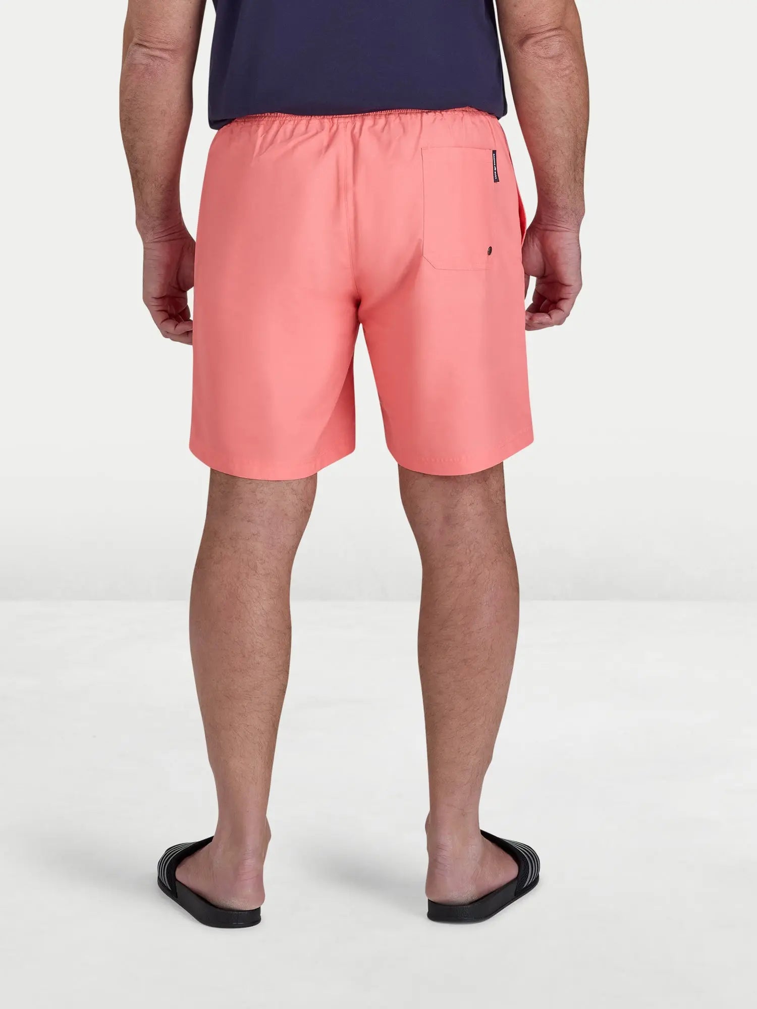 Man wearing Raging Bull Swim Shorts - Coral, back.