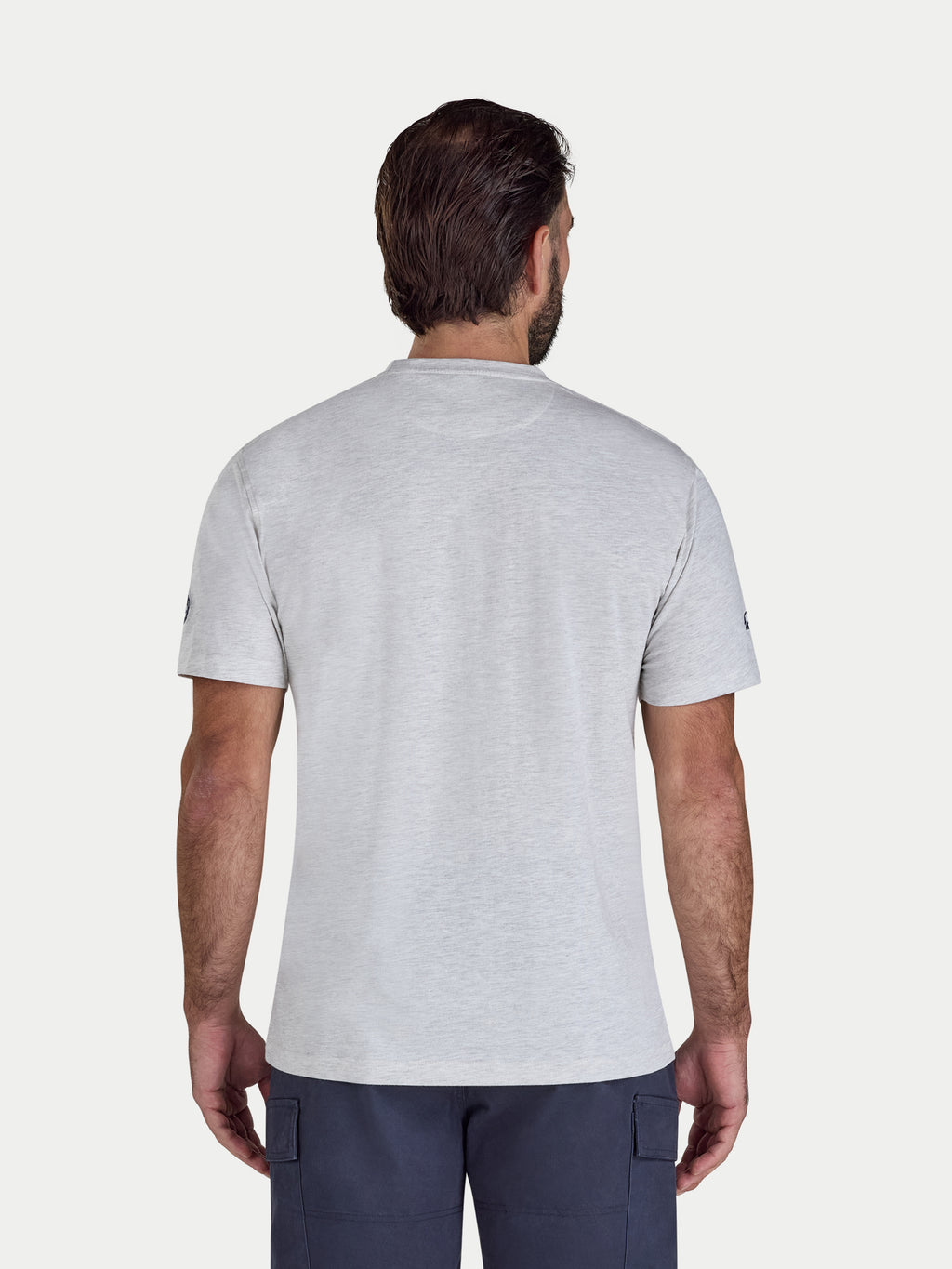 Man wearing a gray t-shirt on a white background