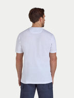 Man wearing a plain white t-shirt on a light gray background