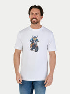 Man wearing a white t-shirt with a graphic design on a plain background