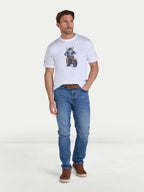 Man wearing a white t-shirt with a graphic design and blue jeans on a white background
