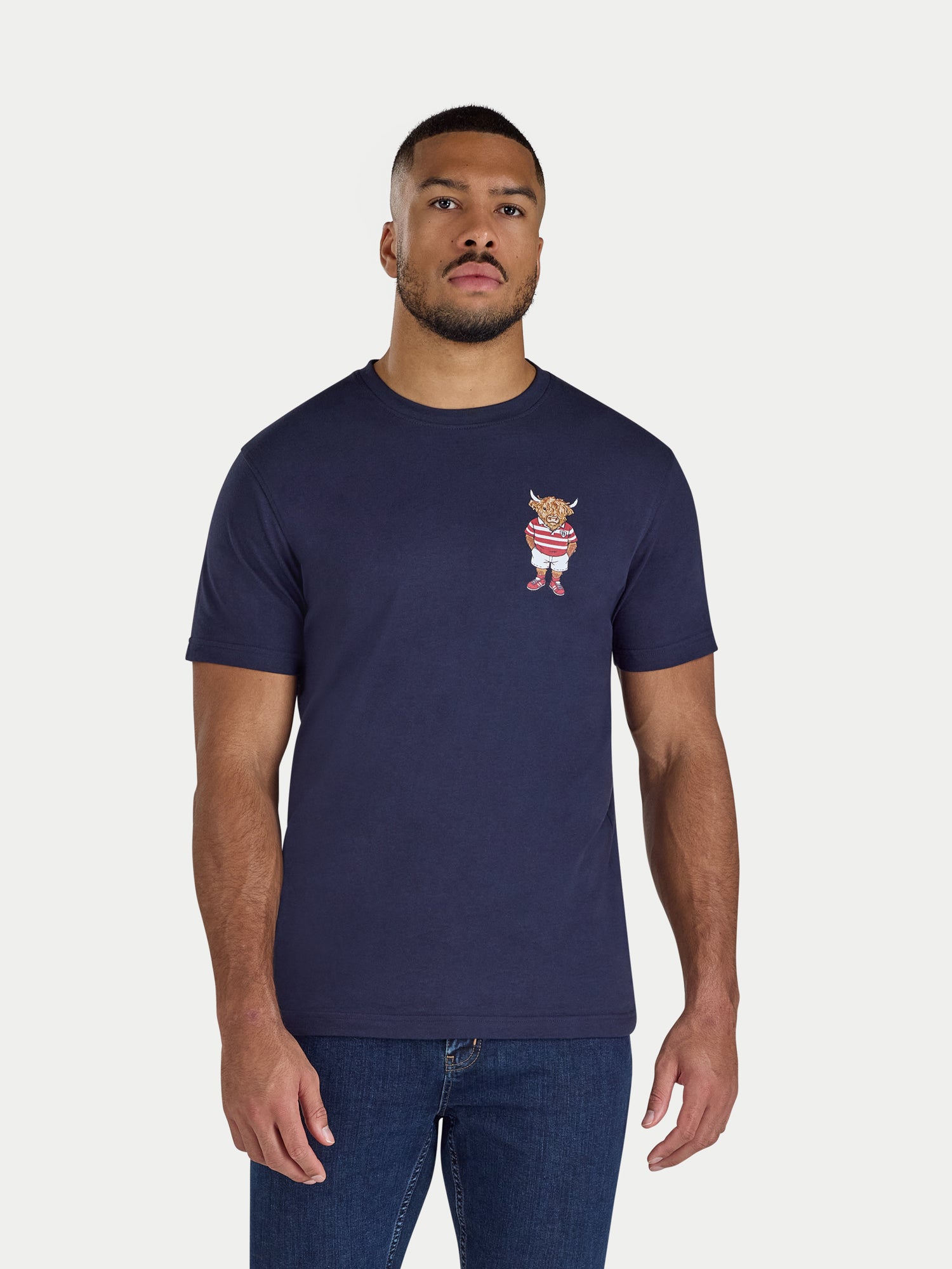 Man wearing a navy blue t-shirt with a small graphic on a white background