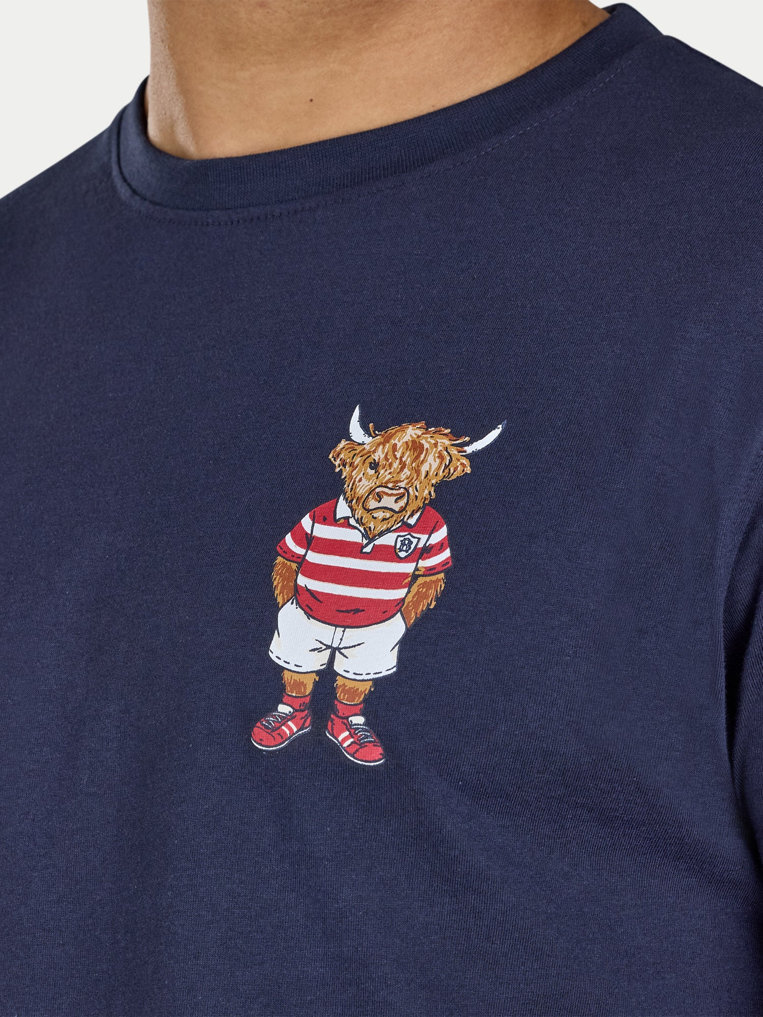 Navy blue t-shirt with a embroidered bull in a red and white striped shirt on a plain background