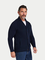 Man wearing a navy blue cardigan on a white background