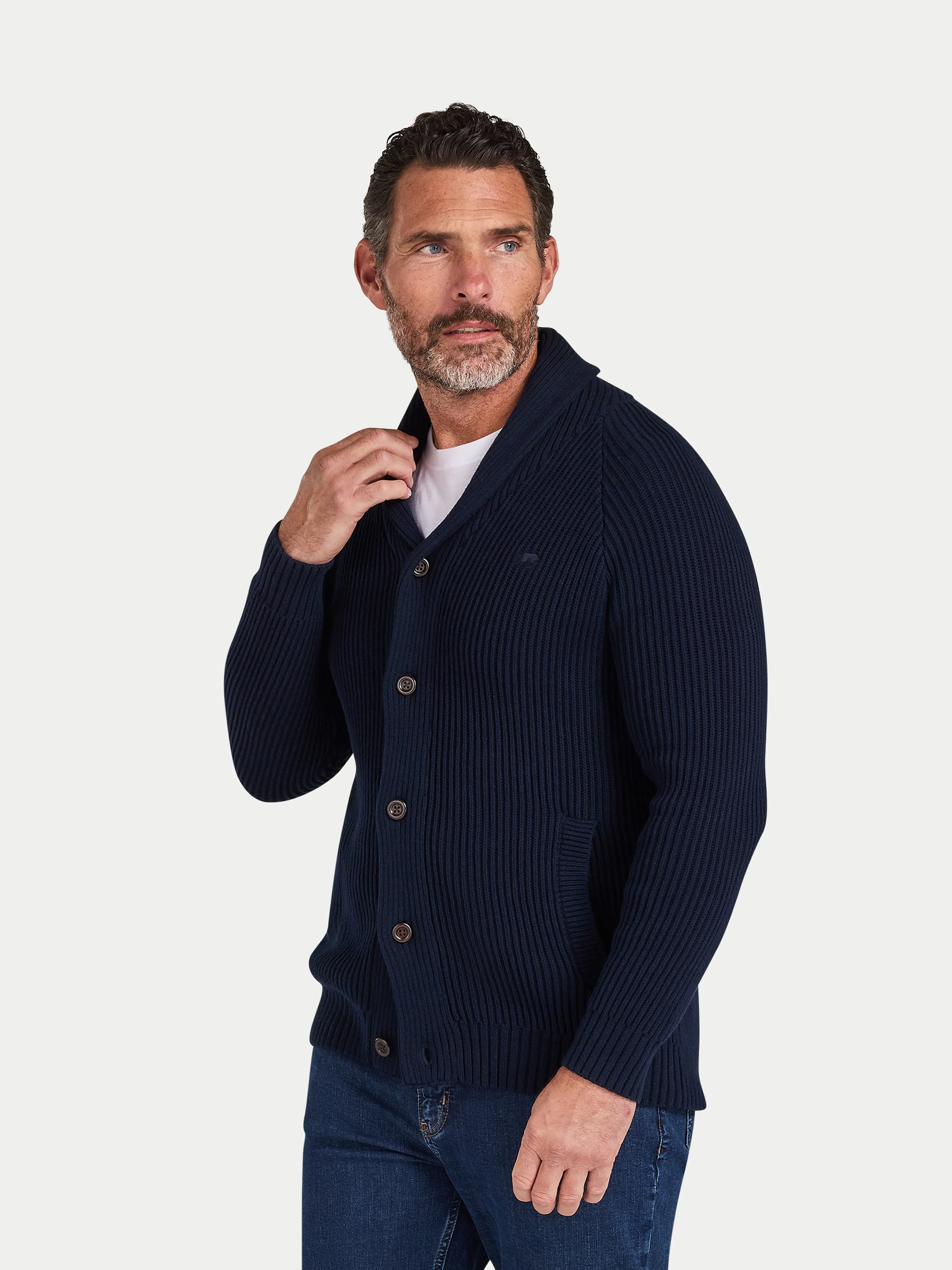 Man wearing a navy blue cardigan on a white background