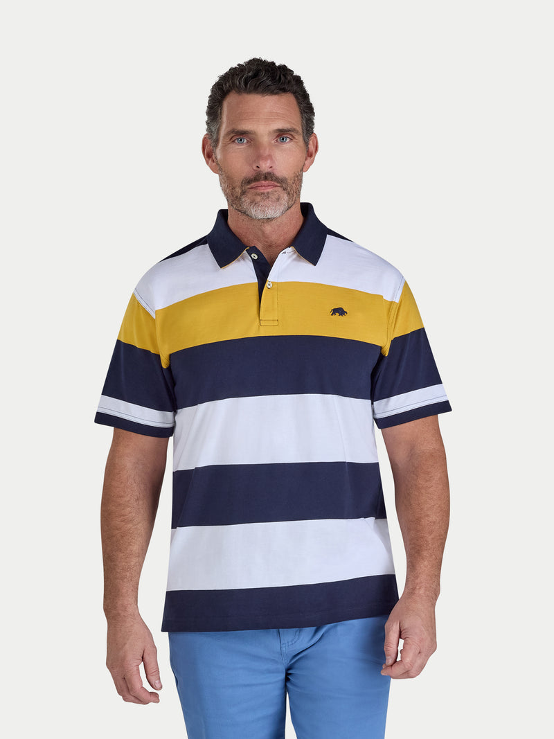 Man wearing a striped polo shirt with a brand logo on a white background