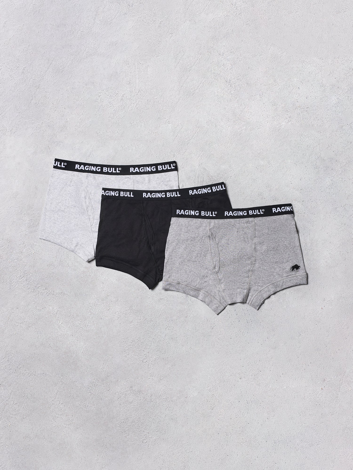 Three pairs of Raging Bull underwear on a light gray background
