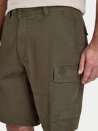 Close-up of olive green cargo shorts with a Raging Bull logo on a white background
