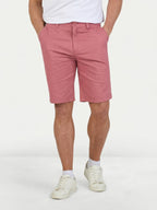 Man wearing Raging Bull Classic Chino Shorts in Berry. 