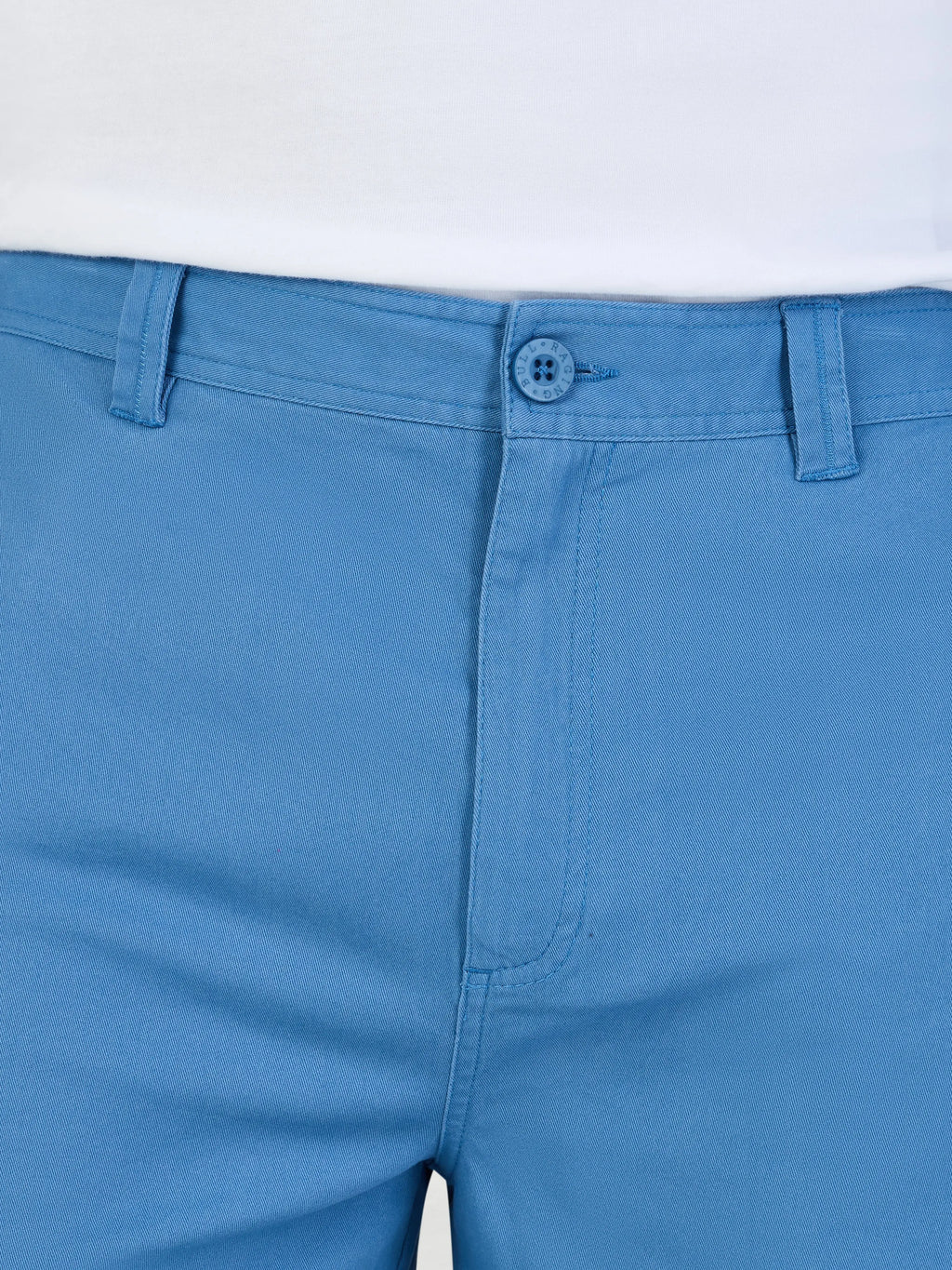 Close-up of blue pants with a white background