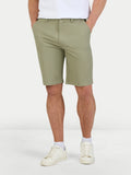 Man wearing classic chino shorts in sage. 