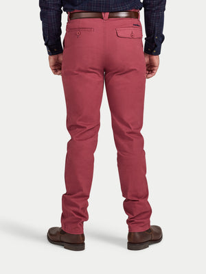 Person wearing red pants on a white background