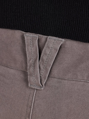 Close-up of a grey belt loop with a black background