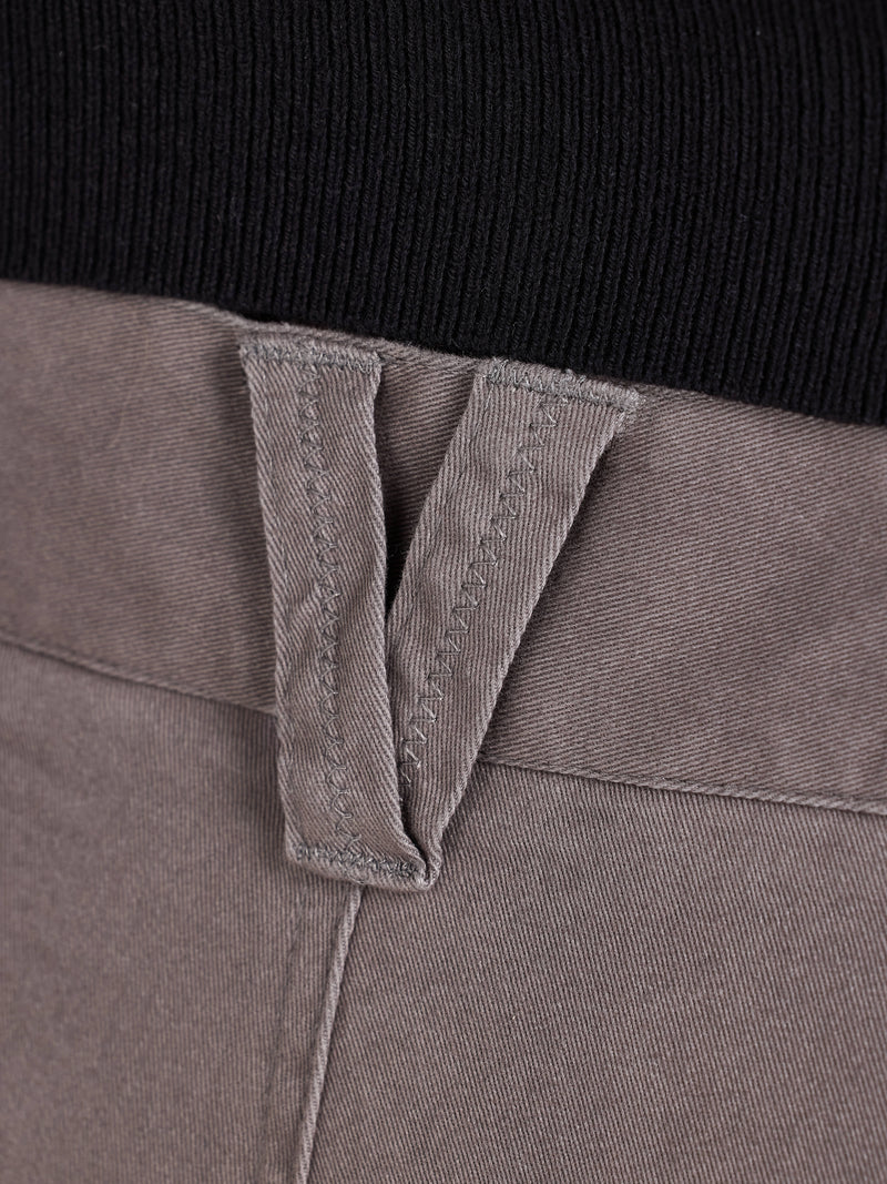 Close-up of a grey belt loop with a black background