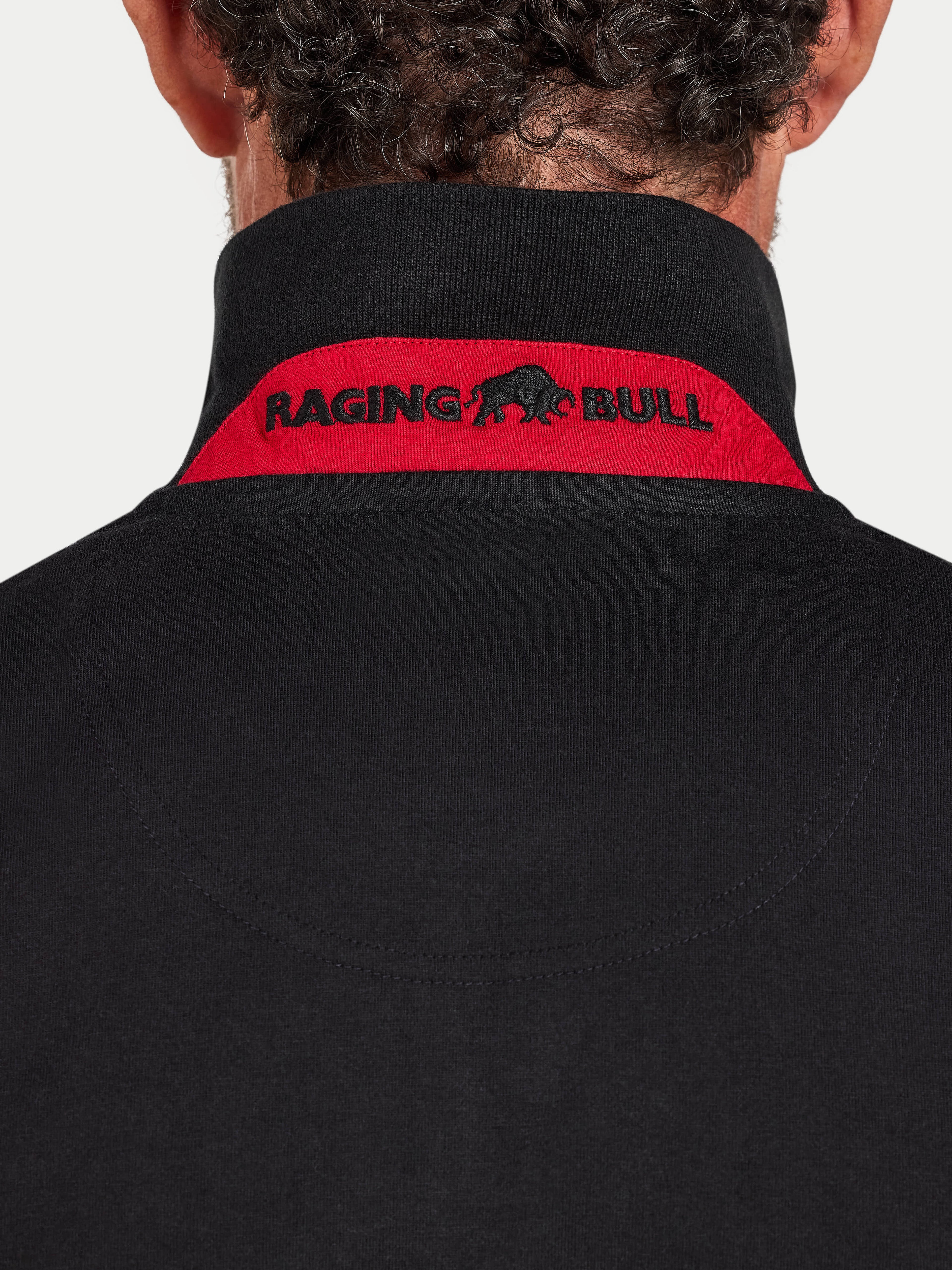 Black jacket with 'Raging Bull' logo on the back against a white background