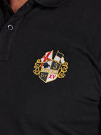 Black polo shirt with an embroidered crest on the chest