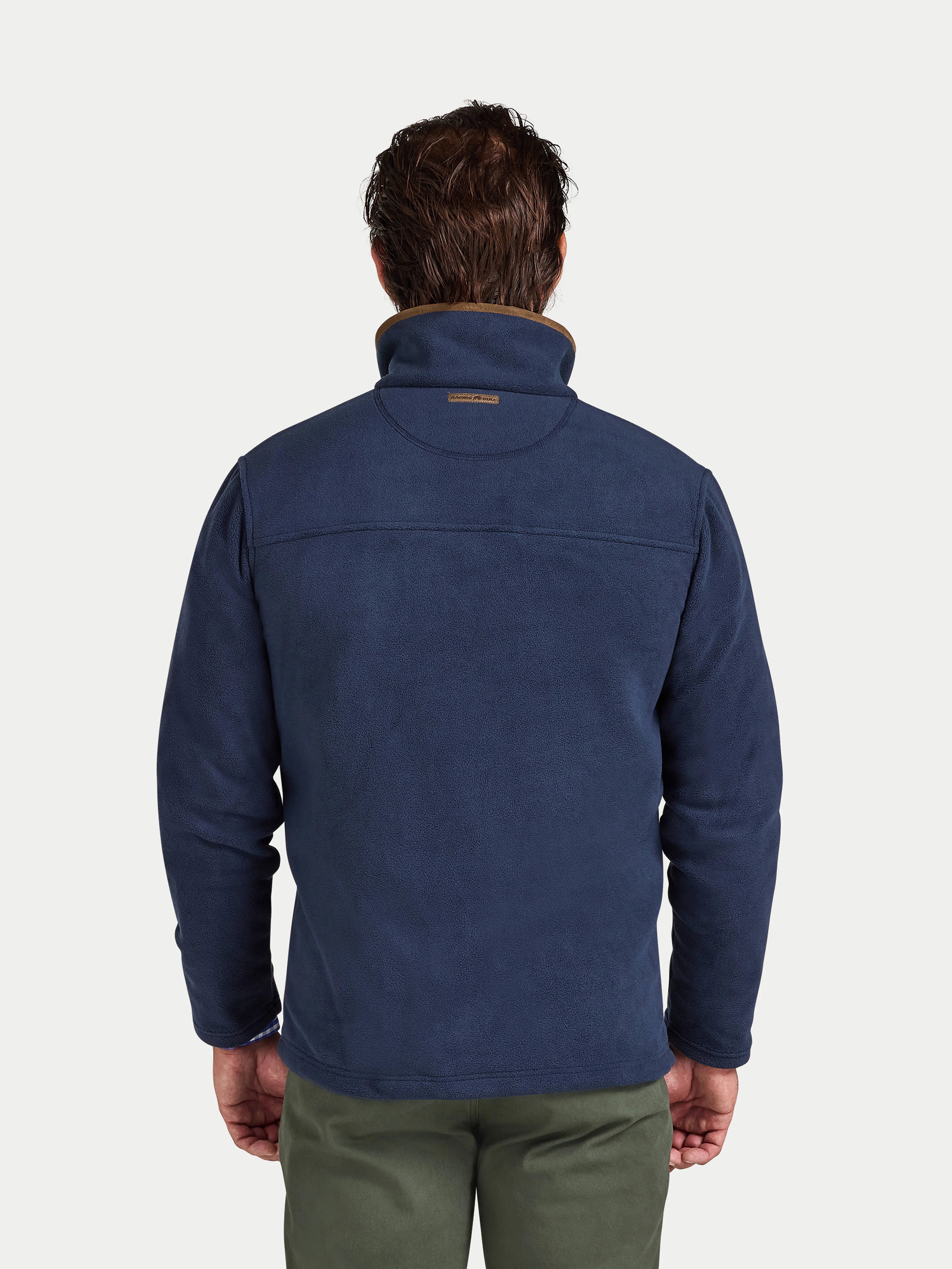 Man wearing a blue fleece jacket on a white background