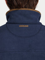 Navy blue jacket with brown collar and 'Raging Bull' logo on a white background