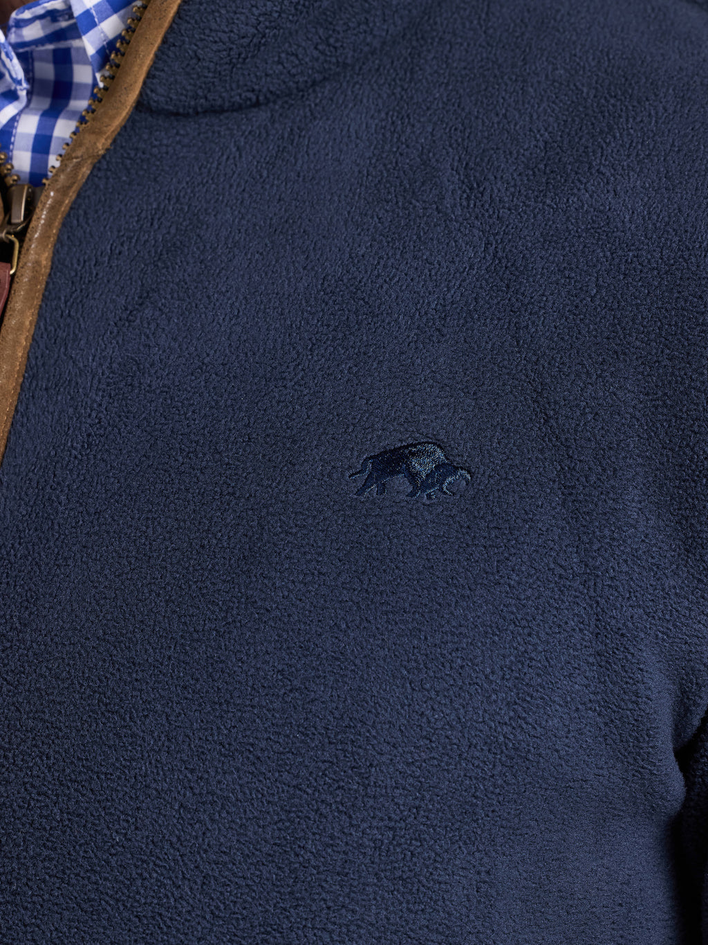 Navy fleece jacket with a small logo on the chest
