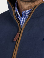 Navy blue jacket with brown zipper and checkered shirt collar