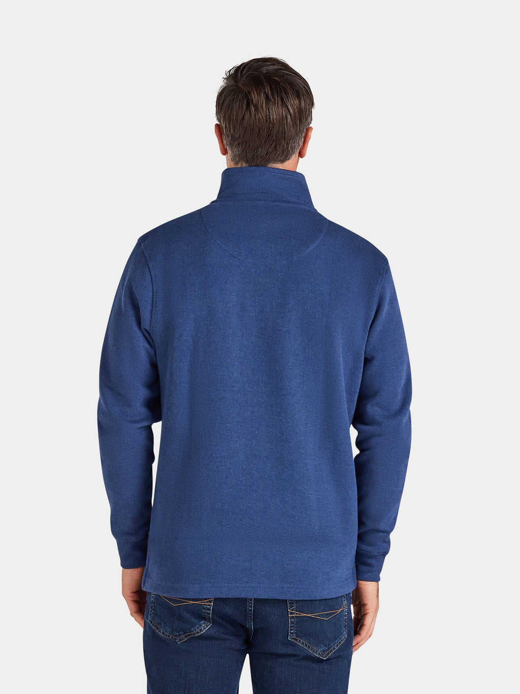 Man wearing a blue sweater on a white background