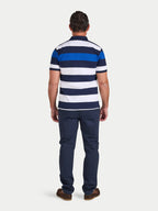 Man wearing a blue and white striped polo shirt and navy pants on a white background