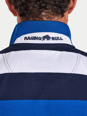 Close-up of a person wearing a blue and white striped shirt with 'Raging Bull' logo.