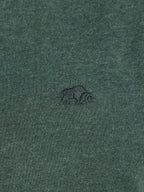 Green fabric with a small logo on a green background