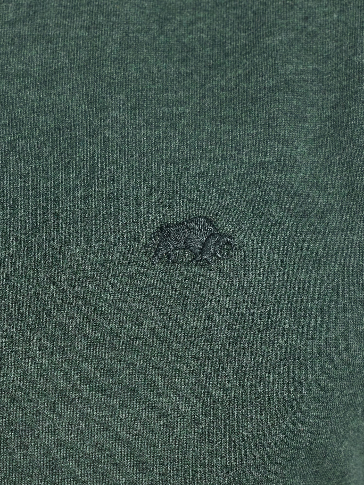 Green fabric with a small logo on a green background