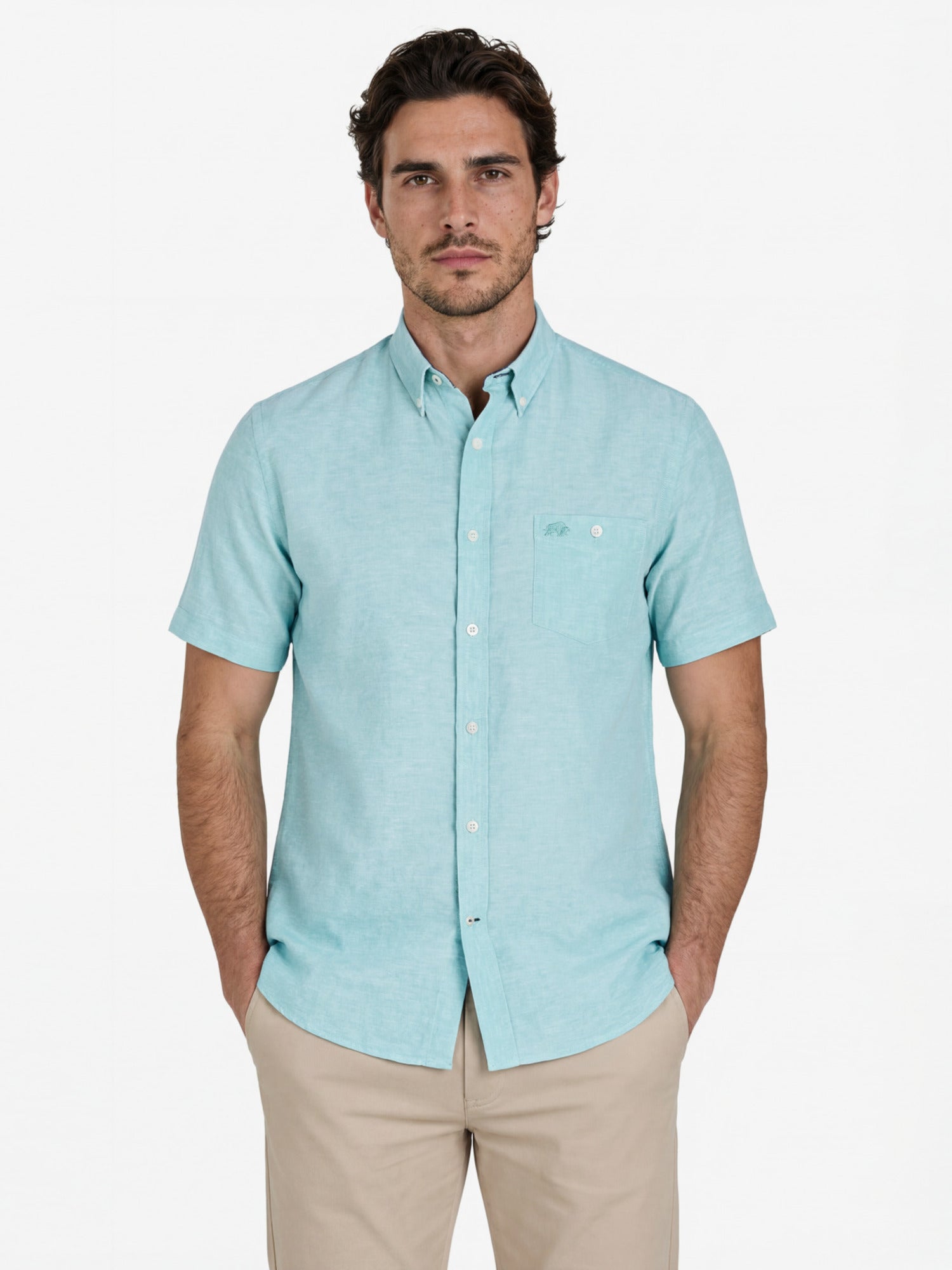 Man wearing a light apple green short-sleeve shirt on a white background