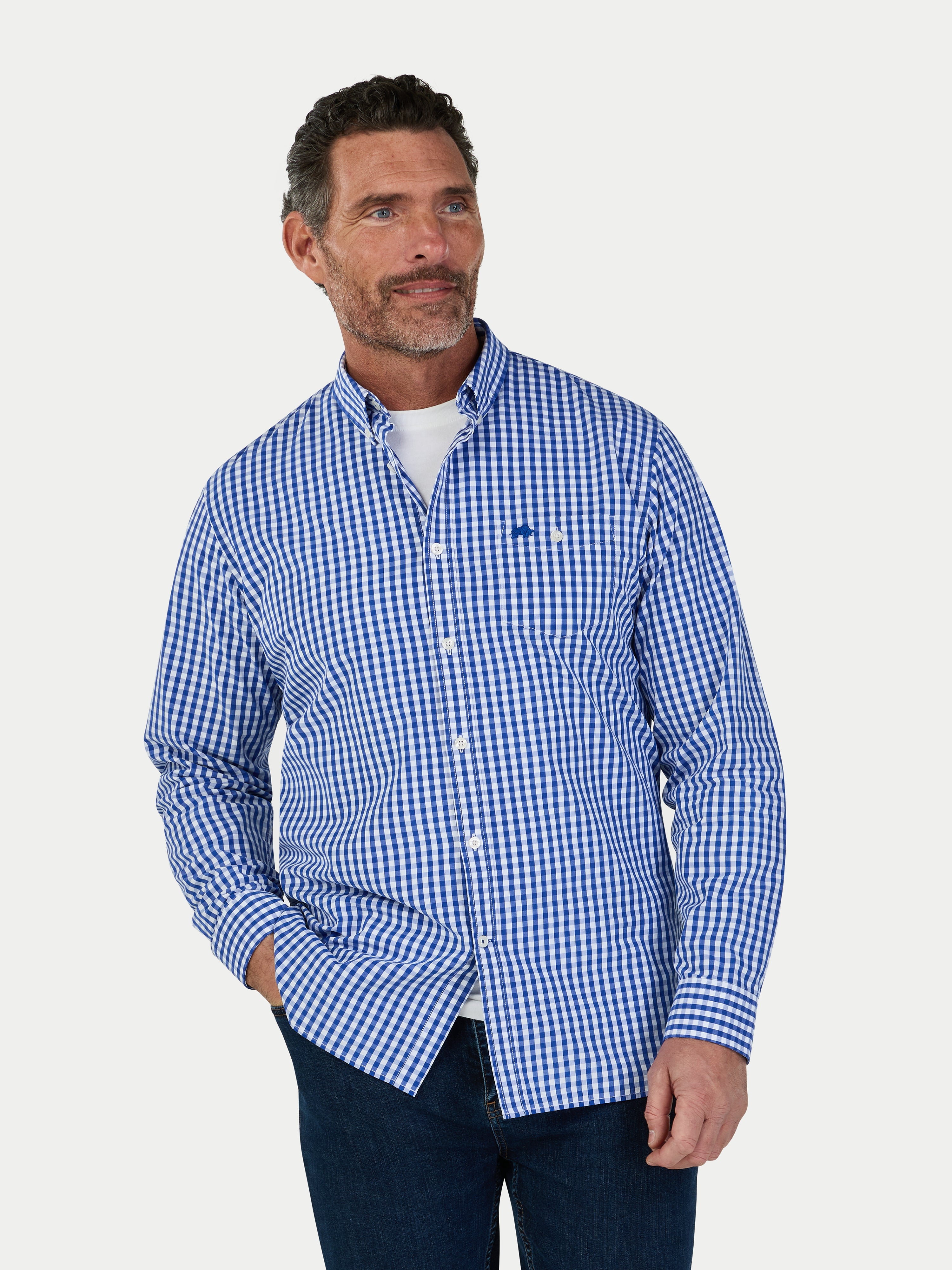 Man wearing a blue checkered shirt on a white background