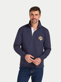 Man wearing a navy blue pullover with a logo on a white background