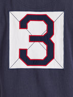Navy blue shirt with a large red and white number '3' on a white background