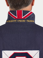 Navy jacket with Union Jack design and embroidered text on a plain background