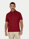Man wearing a red polo on white background. 