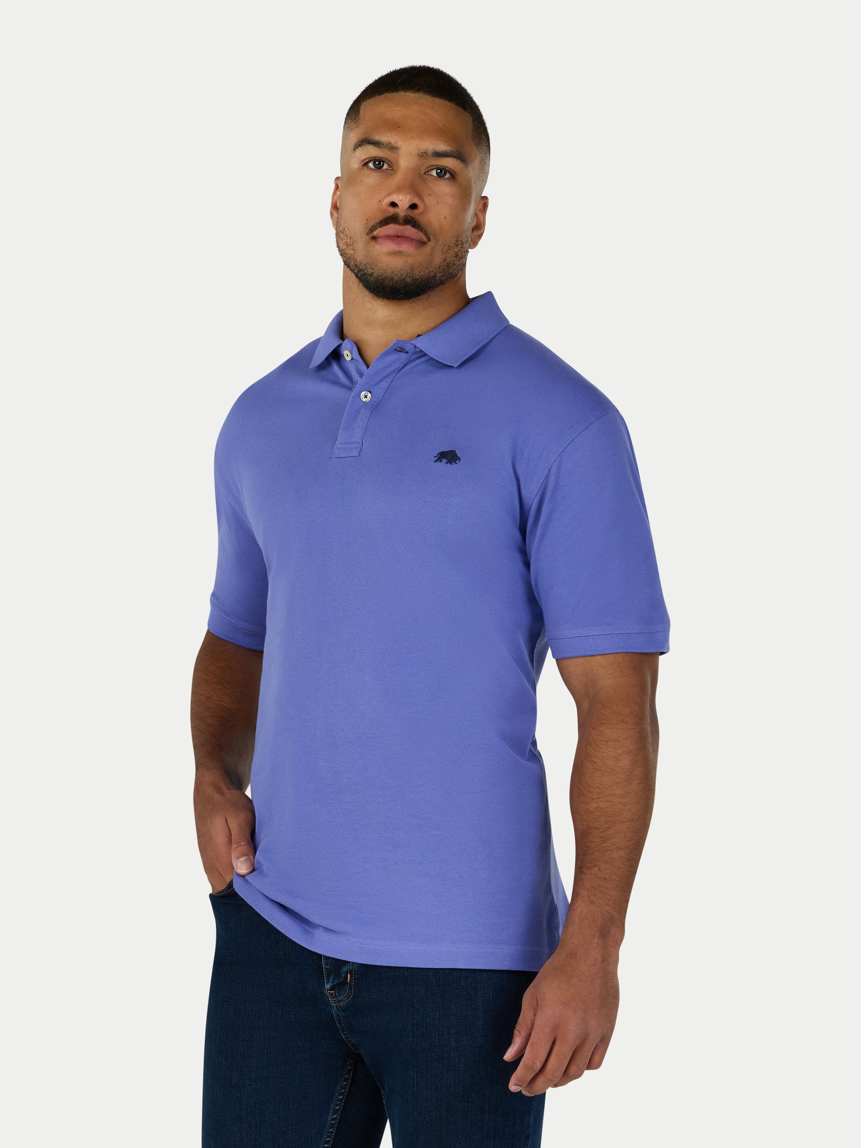 Man wearing a purple polo shirt on a white background