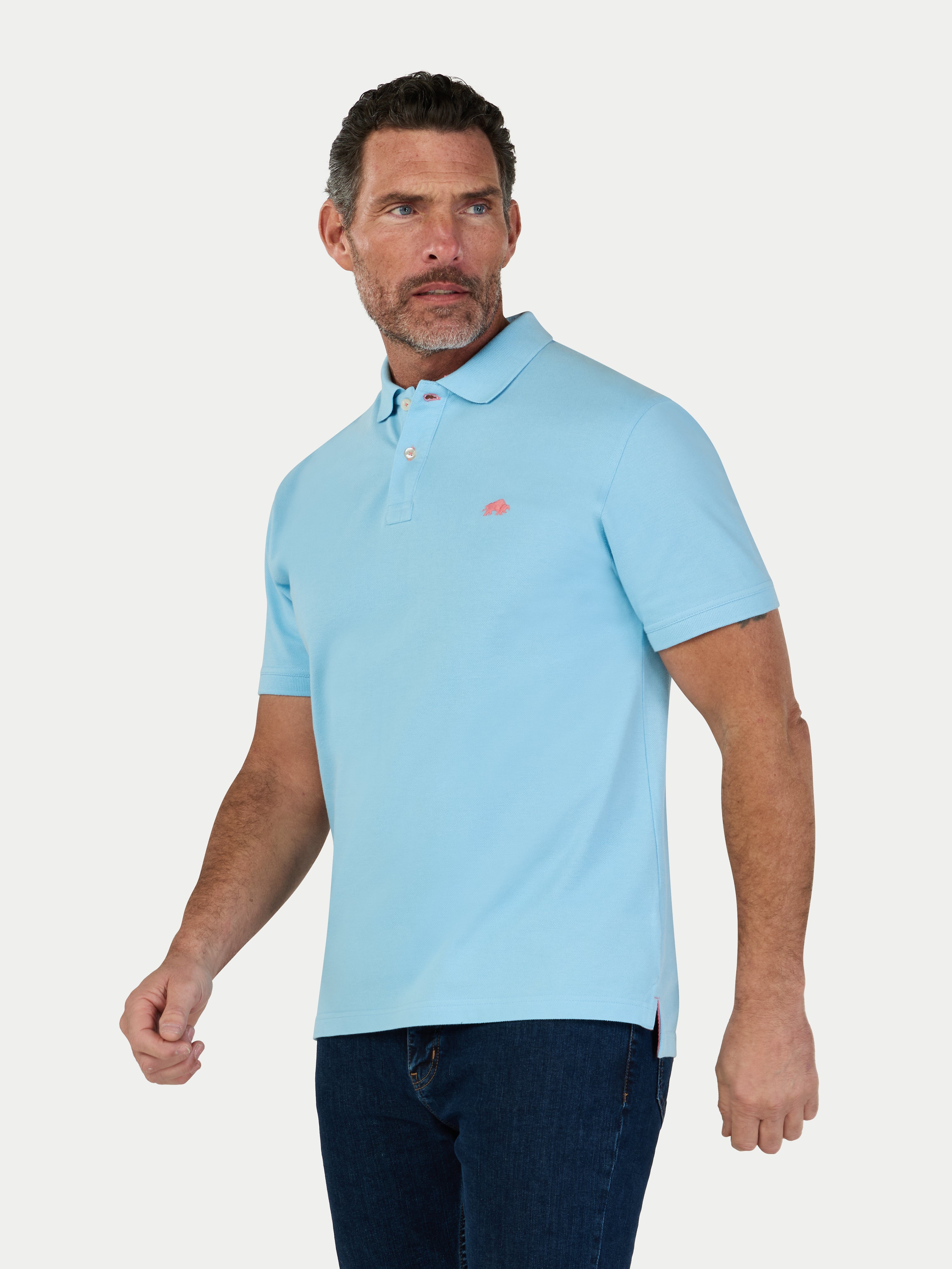 Man wearing a light blue polo shirt on a white background