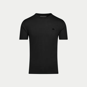Black t-shirt with a small logo on a light gray background
