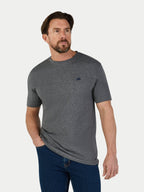 Man wearing a gray t-shirt with a small Raging Bull logo on a white background