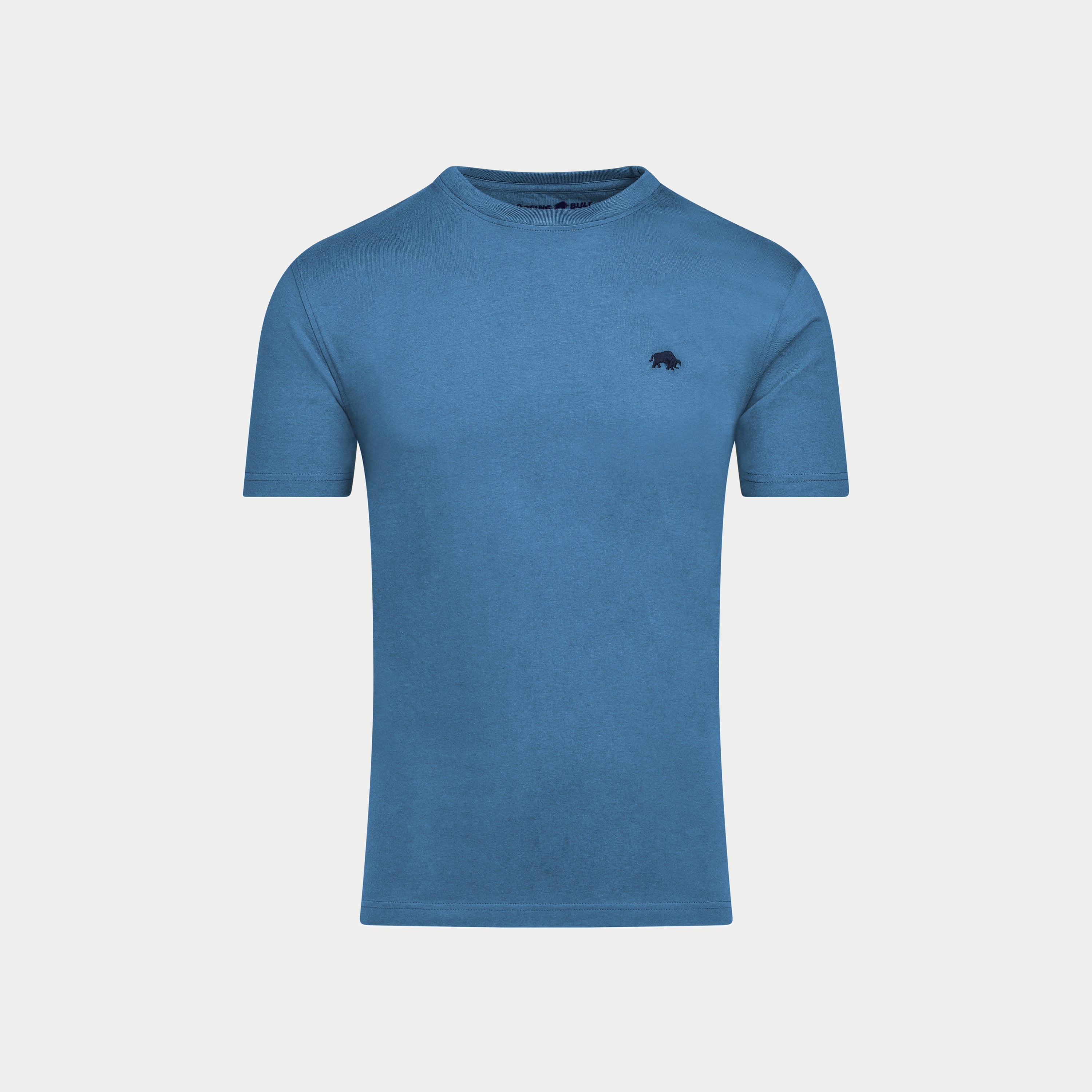 Blue t-shirt with a small logo on a light gray background