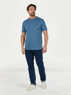 Man wearing a Raging Bull Classic Organic T-Shirt in denim blue and Regular Jeans in Denim, front. 