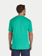 Man wearing a green t-shirt on a white background
