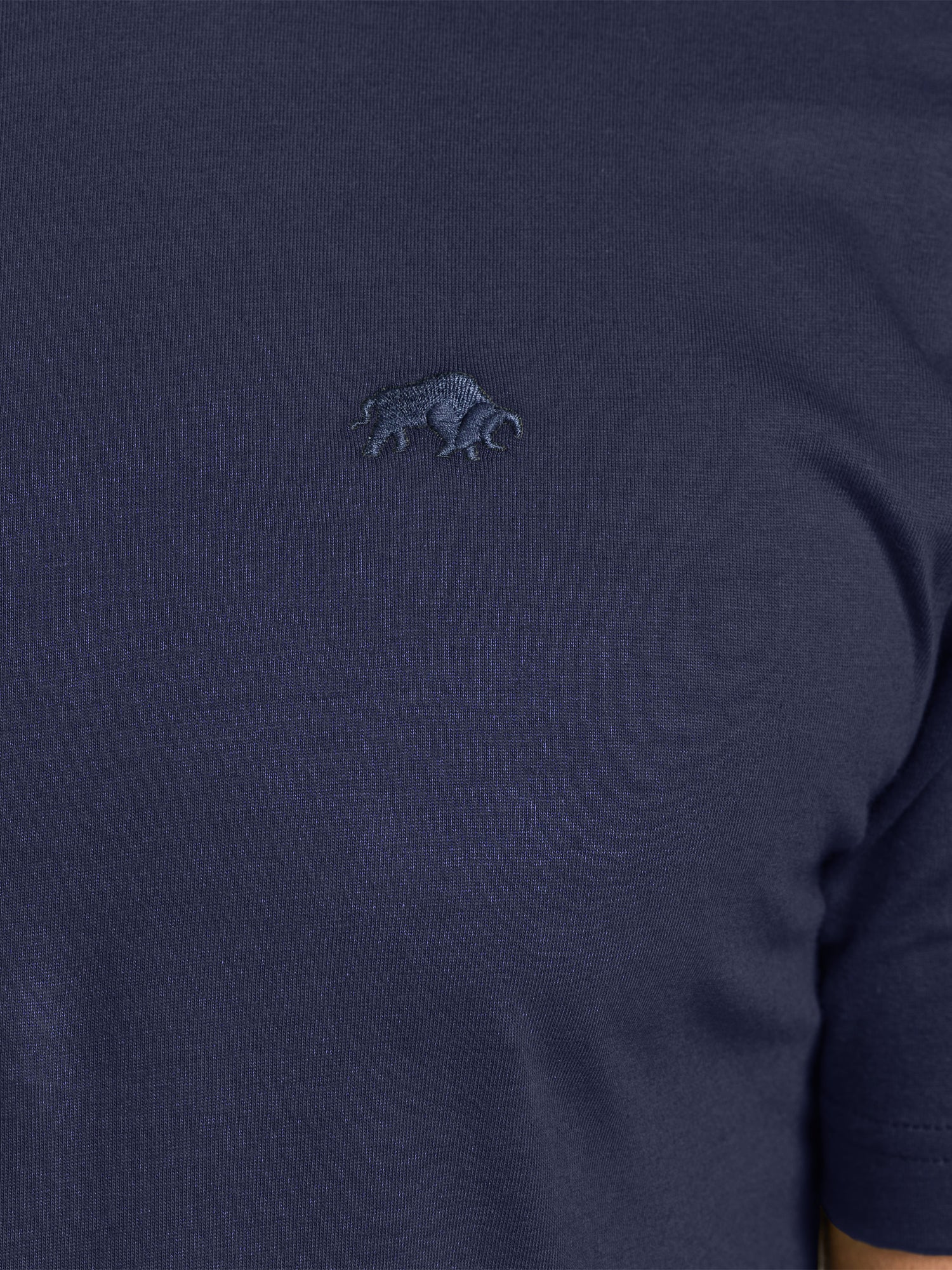 Navy blue sweater with a small embroidered logo on the chest.