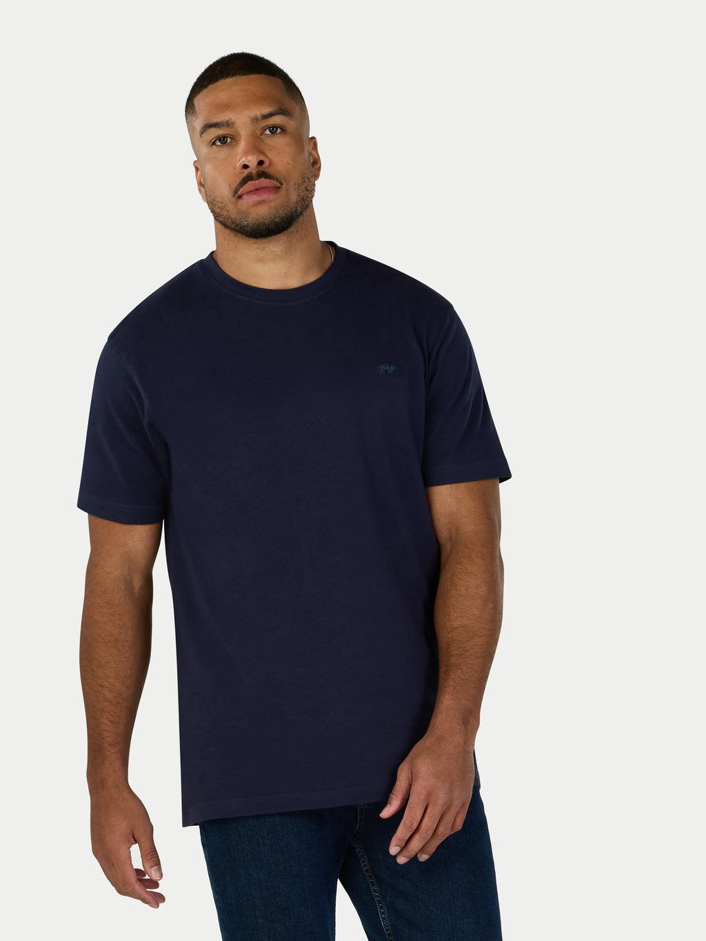 Man wearing a navy blue t-shirt on a white background